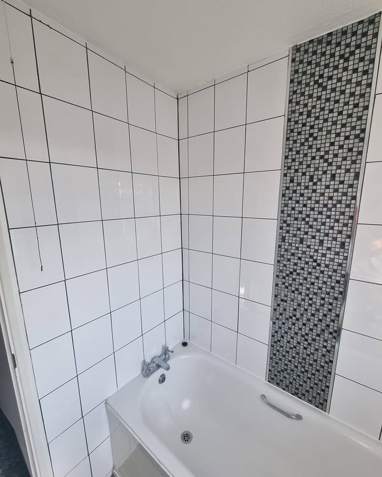 Bath with no shower or screen fitted, before installation