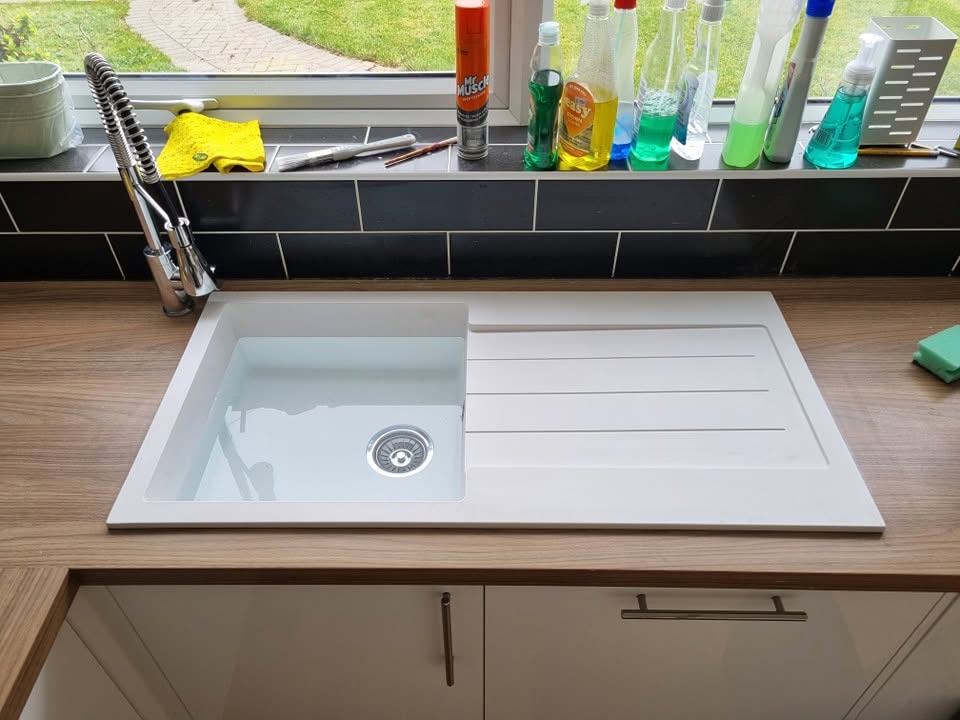 New white composite kitchen sink after replacement